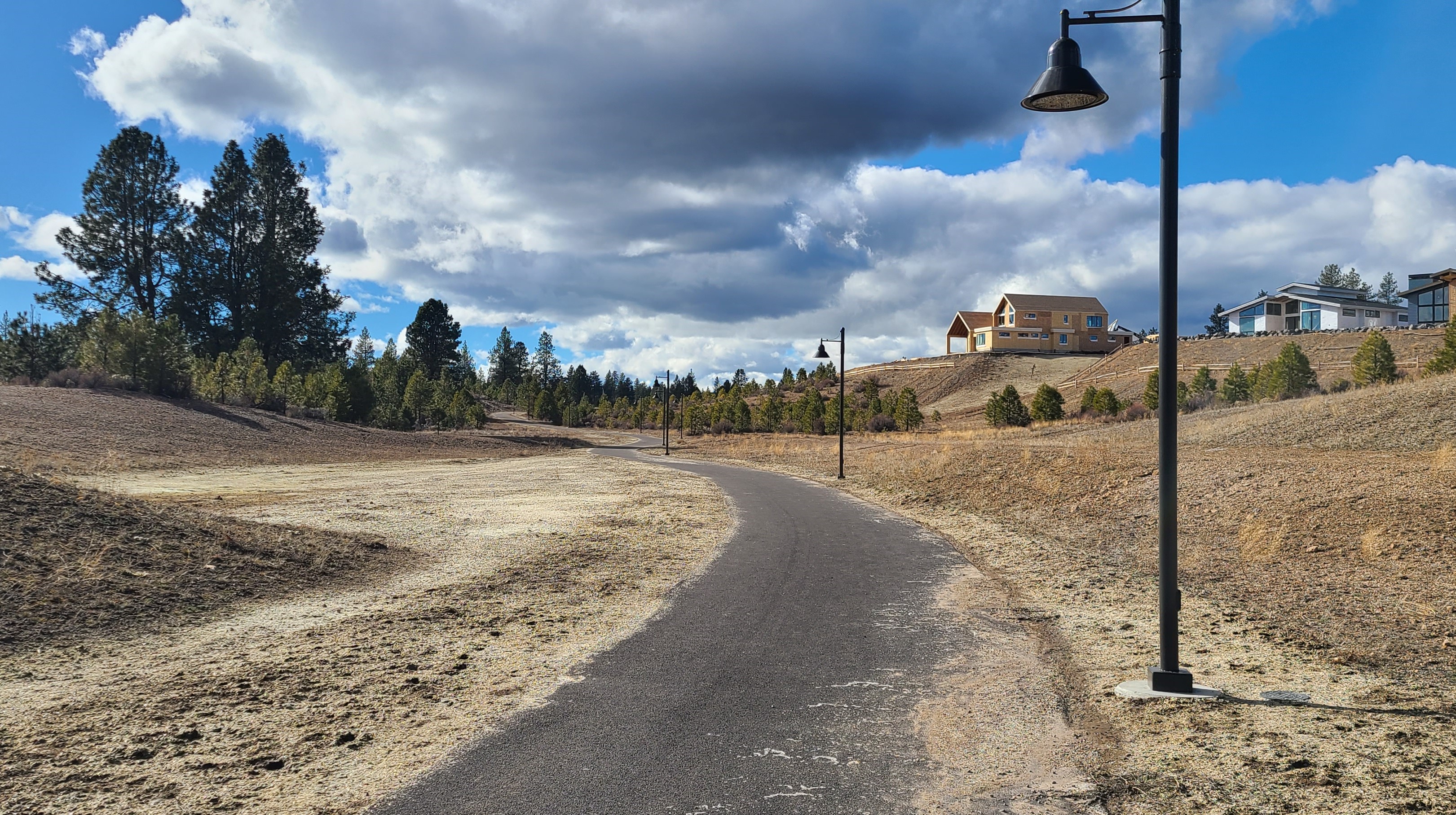 The paved Outback trail going through open space at Discovery West