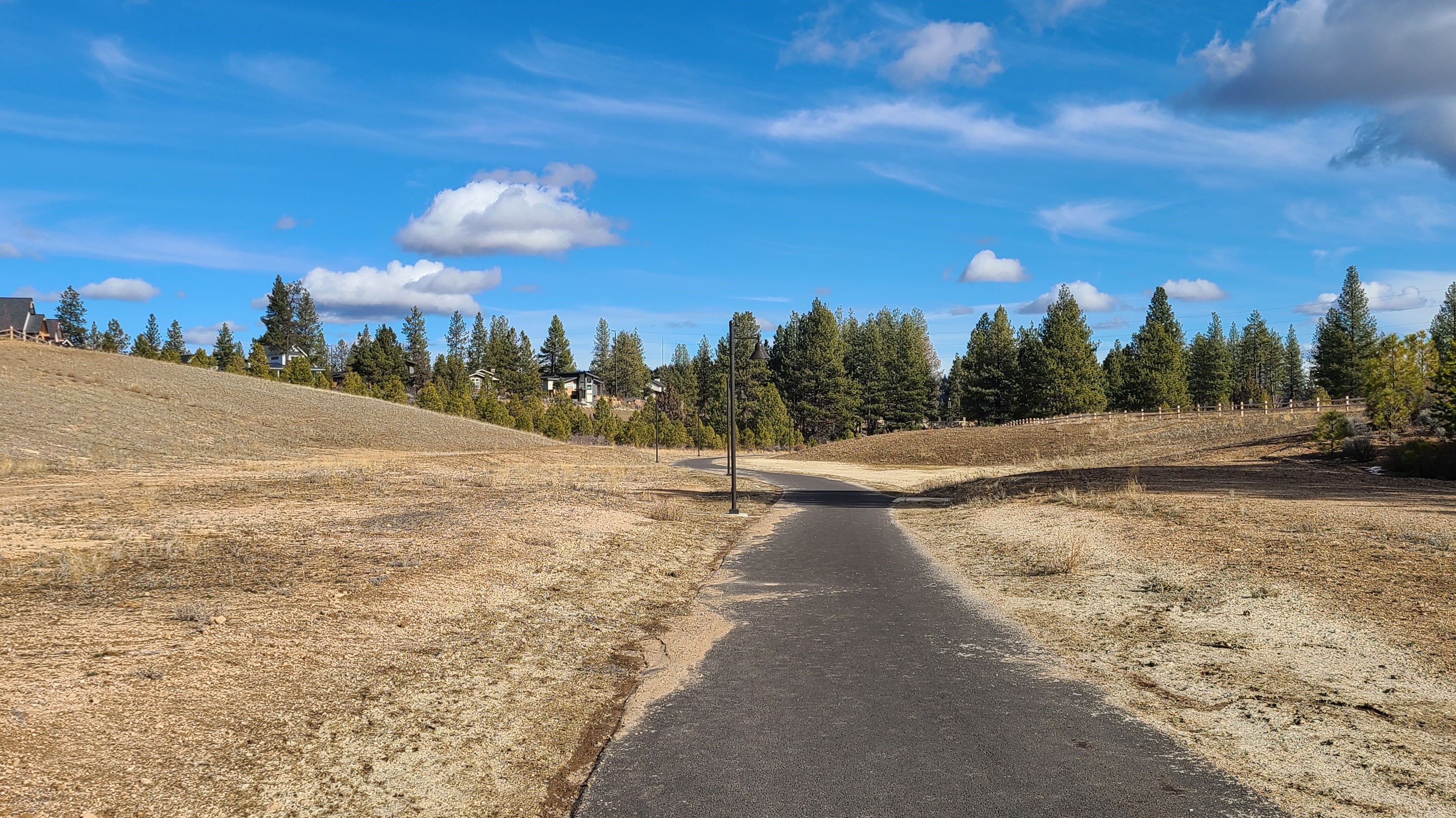 The paved Outback trail going through open space at Discovery West