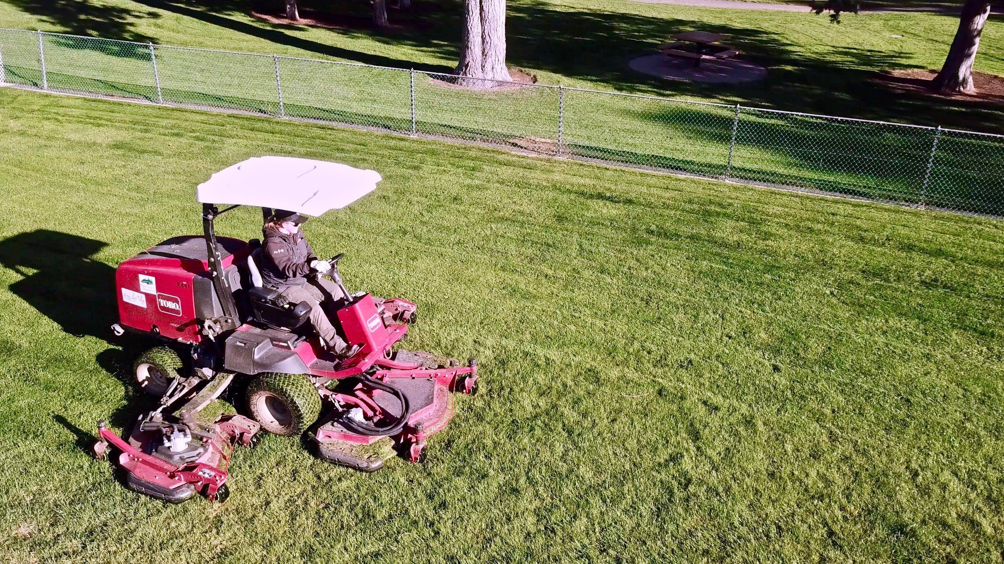 woman on riding lawn mower