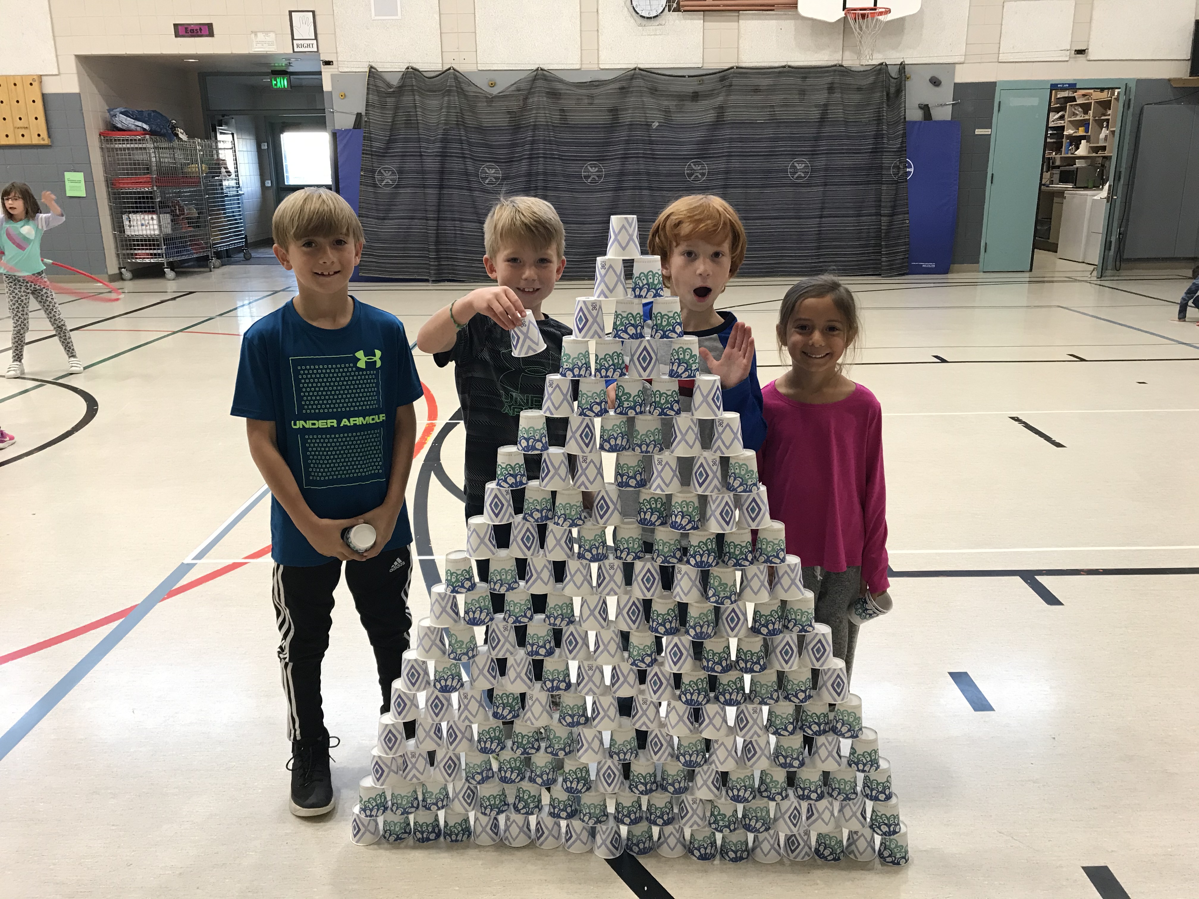 kids showing off their tower of cups