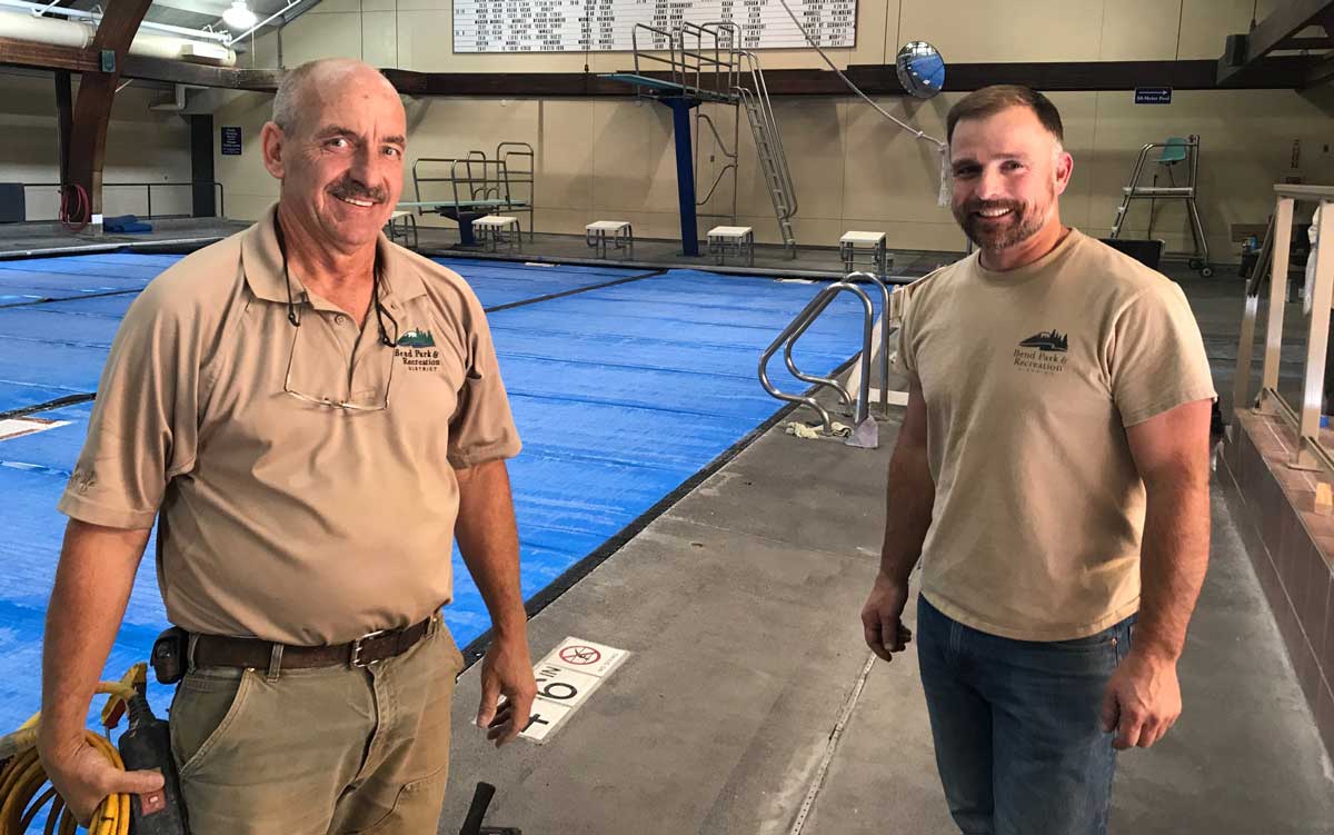 maintenance staff by the pool