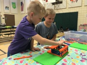 kids playing with crafts in a gym