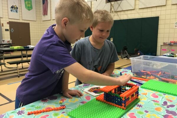 kids playing with crafts in a gym
