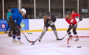 girls practicing hockey