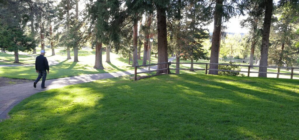 a man walking through drake park