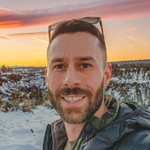 head portrait of Brandon Ward personal trainer with sunset and winter landscape in background