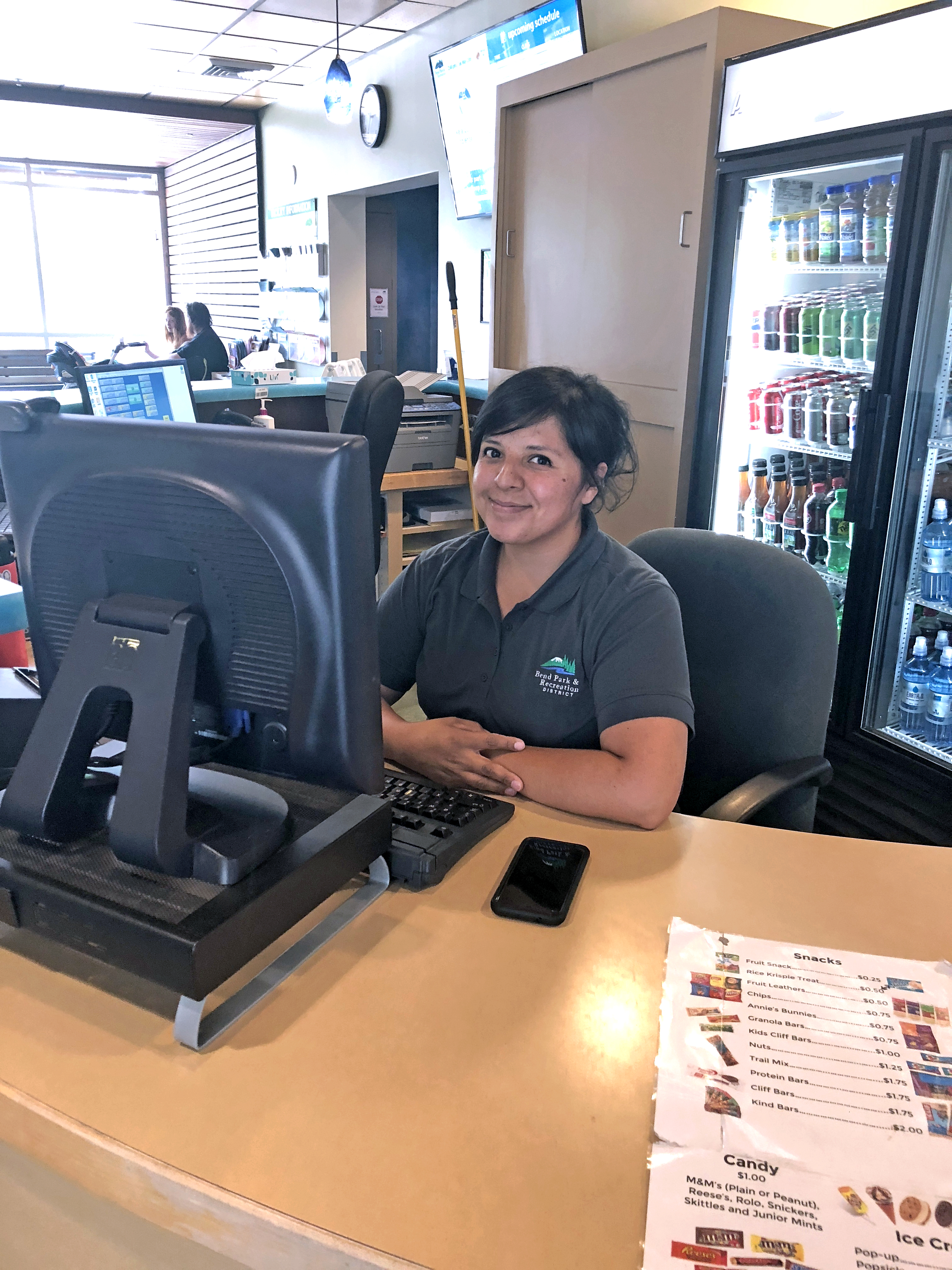 customer service staff at front desk computer