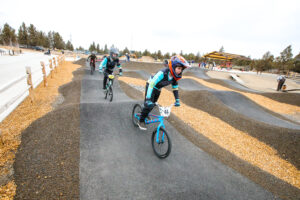 Banner of riders at Big Sky Pump Track