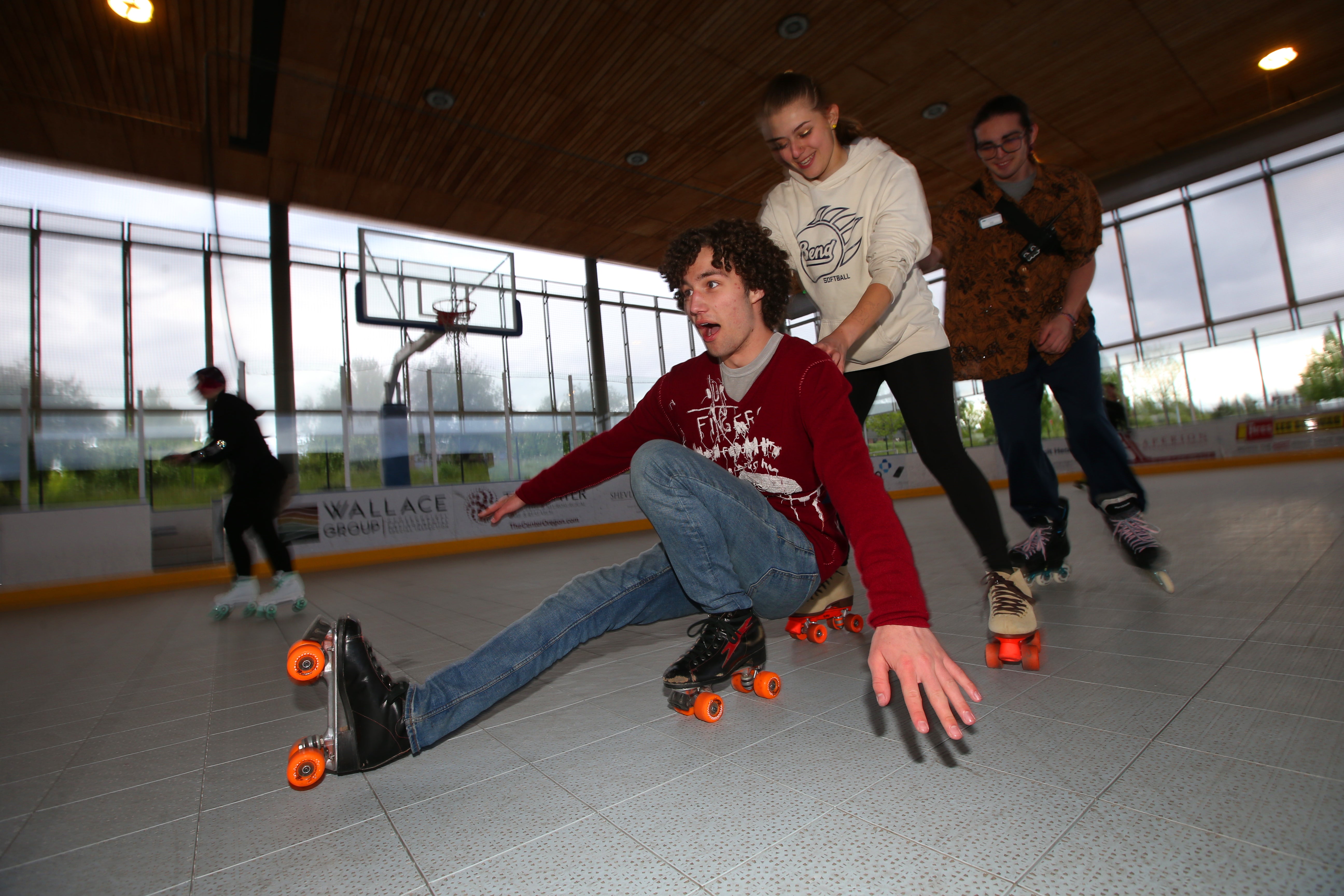 Photo of a group of friends skating together at a Pavilion roller party.