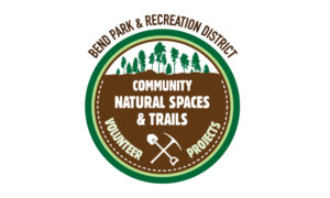 Logo with forest and shovels silhouette for Bend Park and Recreation District Community Natural Spaces and Trails Volunteer Projects