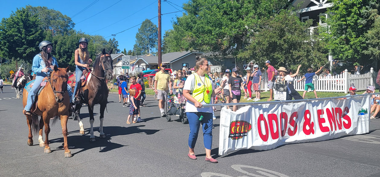 two people on horse back lead the parade