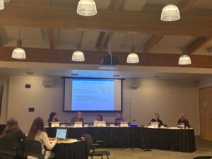 5 elected board members and BPRD executive director at a table with presenters from BPRD staff at the Nov. 4 board of directors meeting