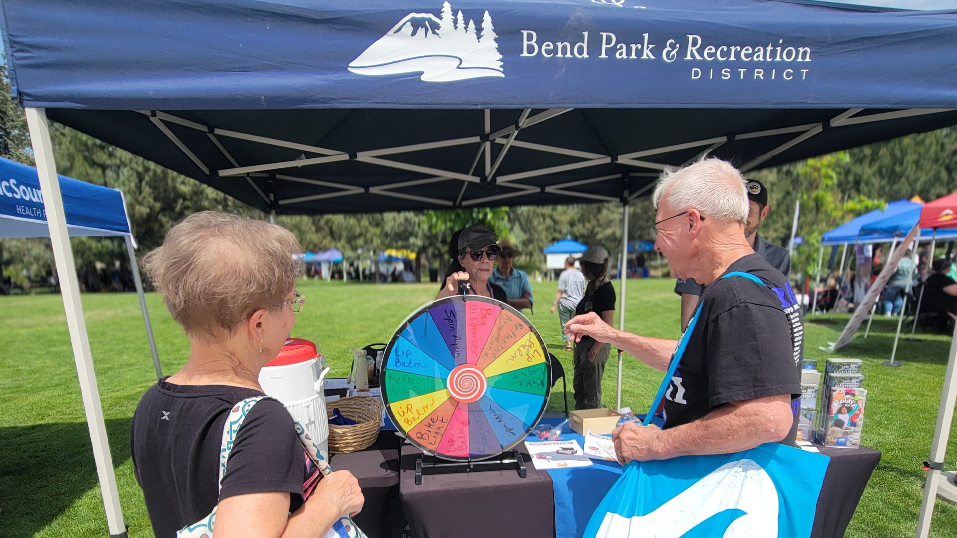 Two patrons visit the BPRD booth at the health expo