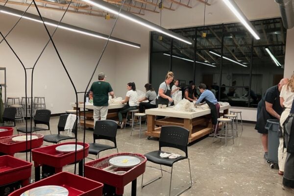 clay classroom with participants working on projects at tables